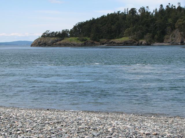 IMG_6293 Rocky beach, blue water, and green land