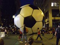 DSCF1911 A big soccer ball balloon.  They had to drag all the balloons down far enough to clear the electric bus wires and traffic lights.