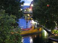 IMG_2493 Here's the canal at dusk, with one of the tour boats floating by at night.